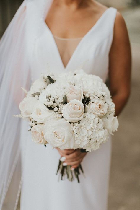 All-White Bridal Bouquet + Style 2268 by Casablanca Bridal | Top 10 Best Wedding Dress and Bridal Bouquet Pairings Bridal Bouquet Ideas White Roses, Wedding Bouquet No Greenery, Timeless White Bridal Bouquet, Structured Bridal Bouquet, Bridal Bouquet Arrangements, White And Light Pink Rose Bouquet, Top Wedding Flowers, Off White Wedding Bouquet, Tall White Rose Wedding Centerpieces