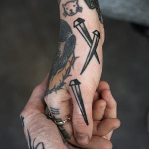 15 Brutal Nail Tattoos | Tattoodo Traditional Nail Tattoo, Tato Tradisional, Best 3d Tattoos, Tattoos For Dad Memorial, Tato Jari, Tato Dengan Makna, Tattoo Filler, Ink Master, Tattoo Meaning