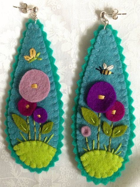 Felt is a fun textile material that is both colorful and creative to use. You can combine these natural fibers with beads, charms, or embroidery threads to create a wide variety of earring designs. Here is a look at some unique and incredible felt earrings designs to get you inspired to create something new today. Felt Earrings, Felted Earrings, Embroidery Threads, Fabric Earrings, Felt Embroidery, Felt Jewelry, Earring Designs, Fiber Jewelry, Wool Projects