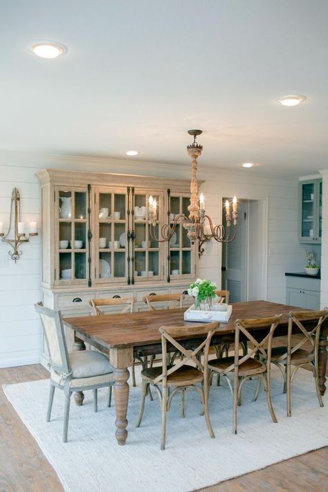 Different wood finishes in this dining room add texture without being too overwhelming, and this dining table can sit up to 8! HGTV Country House in a very Small Town, 20 Best Fixer Upper Rooms via A Blissful Nest Stile Joanna Gaines, Joanna Gaines Dining Room, Dining Room Buffet Decor, Fixer Upper Dining Room, Mixed Dining Chairs, French Country Dining Room Decor, Case In Stile Country, French Country Dining Room, 2024 Kitchen