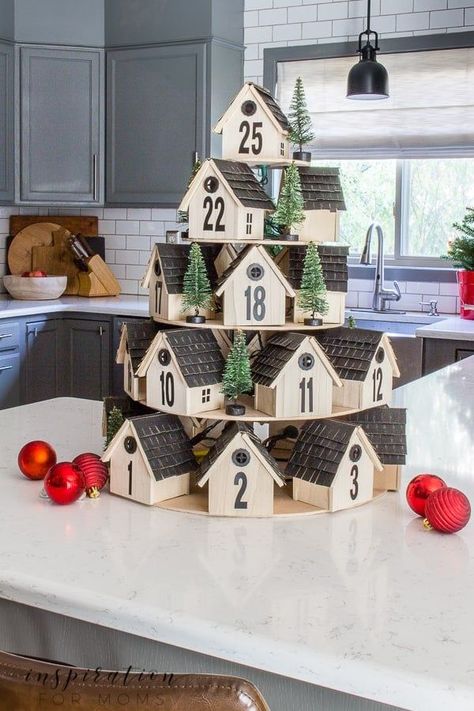 Countdown to Christmas with this festive wooden houses Advent calendar. I give you all the steps to easily create one for your own home! Find the complete tutorial here: https://inspirationformoms.com/diy-tiered-wooden-houses-advent-calendar/ #adventcalendar #christmas Wooden House Advent Calendar, Gingerbread Clay, Permainan Kerjasama Tim, Advent Calendar House, Advent House, Calendar Inspiration, Calendar Advent, Christmas Advent Calendar Diy, Advent Calender