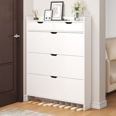 Keep your home tidy and organized, starting with your shoe cabinet. This shoe cabinet is beautifully designed to make it easy to organize and find your favorite shoes. Every pair of shoes holds stories and memories, making every time you wear them a great time. | Latitude Run® 18 Pair Shoe Storage Cabinet Manufactured Wood in Brown / White | 49.21 H x 39.37 W x 6.69 D in | Wayfair | Organization Organisation, Mirror Shoe Rack, Small Shoe Cabinet Entryway, Shoe Cabinet Garage, Front Door Shoe Storage Entryway Small Spaces, Slim Cabinet Storage, Shoe Entryway Storage, Small Corner Storage, Shoe Cabinet Entryway Modern