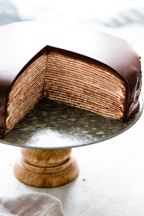 Delicious and surprisingly easy recipe for chocolate crepe cake from Anna Banana Co. Beautiful layers of soft crepes with whipped chocolate cream create this visually stunning cake, making it perfect for any occasion! #crepecake #dessert #pancakeday Matcha Crepe Cake, Chocolate Crepe Cake, Crepe Cake Recipe, Chocolate Crepes, Anna Banana, Impressive Desserts, Mille Crepe, Crepe Cake, Impressive Recipes