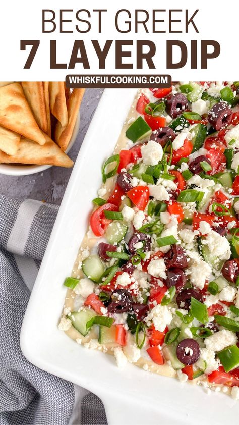 A platter with Greek 7 Layer dip and a dish of pita chips on the side Greek Hummus Recipe, Greek 7 Layer Dip, Greek Hummus Dip, Greek Dip Recipes, Creamy Corn Dip, Greek Layer Dip, Greek Dip, Layered Dip Recipes, 7 Layer Dip