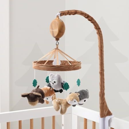 Whimsical Woodland Musical Mobile by The Peanutshell helps to promote baby's auditory development, motor skills and visual stimulation. Our thoughtfully designed nursery essential features a soft velour bear, deer, owl, moose and fox surrounded by green felt leaves and central white cloud. A faux woodgrain printed ring construction adds extra forest flair to your nursery. The digital music box plays snippets of 12 different lullabies to sooth your little one gently to sleep. Easily switch music Woodsy Nursery, Forest Nursery Theme, Wilderness Nursery, Owl Themed Nursery, Printed Ring, Forest Animal Nursery, Woodland Animals Theme, Whimsical Woodland, Forest Nursery