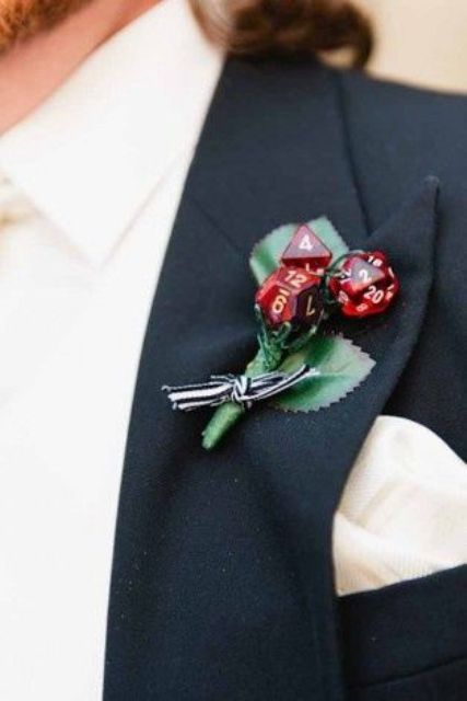 a creative wedding boutonniere of silk leaves, red dices and a striped bow is a fun idea for a groom who loves to play Red Boutonniere, Gamer Wedding, Nerd Wedding, Geeky Wedding, Nerdy Wedding, Halloween Fest, Geek Wedding, Fantasy Wedding, Future Wedding Plans