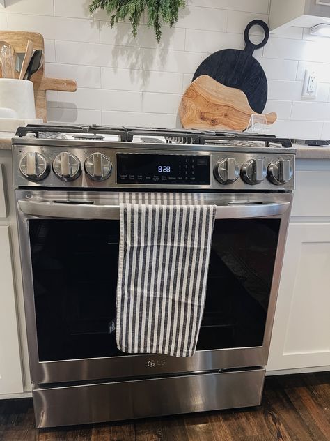 How to Style the Stove Area - Life Love Larson Decor Behind Stove Top, Behind Oven Decor, Decor Behind Stove, Behind Stove Decor, Behind The Stove Decor, Kitchen Stove Decor, Style Countertops, Marble Utensil Holder, Stove Decor