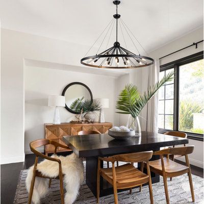 This sputnik wagon wheel chandelier with openwork aesthetic angles can therefore skillfully pair with your space, suitable for kitchen island, dining rooms, living room, bedrooms, breakfast, porch, hallways, office, entryways, foyer, staircase, farmhouse, dining table, entrance, kitchen table, bars, entry, cafes, hotels, and restaurants etc. Finish: Matte Black | George Oliver Kinzah 12 - Light Dimmable Wagon Wheel Chandelier in Black | 31.5 H x 43.31 W x 43.31 D in | Wayfair Staircase Farmhouse, Dining Lights, Black Dining Room Table, Black And White Dining Room, Dark Dining Room, Entrance Kitchen, Foyer Staircase, Light Chair, Lights Hanging