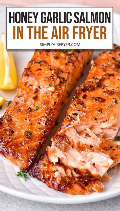 cooked honey garlic salmon fillets on white plate with text overlay "honey garlic salmon in the air fryer". Easter Entrees, Air Fryer Recipes Salmon, Salmon Recipes Baked Healthy, Honey Garlic Salmon, Garlic Salmon, Air Fryer Oven Recipes, Easy Salmon Recipes, Air Fyer Recipes, Air Frier Recipes