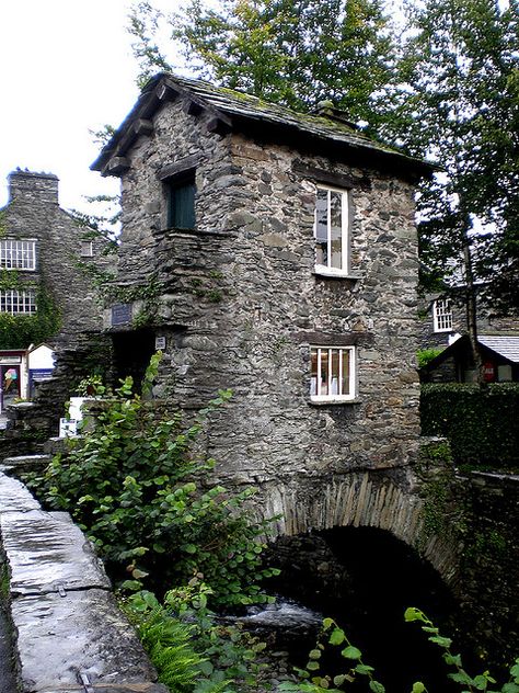 Ambleside Bridge House,  built by the Braithwaite family in the 17th century to access their land over Stock Beck and to store apples from their orchards. Bridge House, Stone Building, House Design Trends, Stone Cottages, Stone Architecture, Amazing Buildings, Stone Cottage, The Lake District, Cabins And Cottages