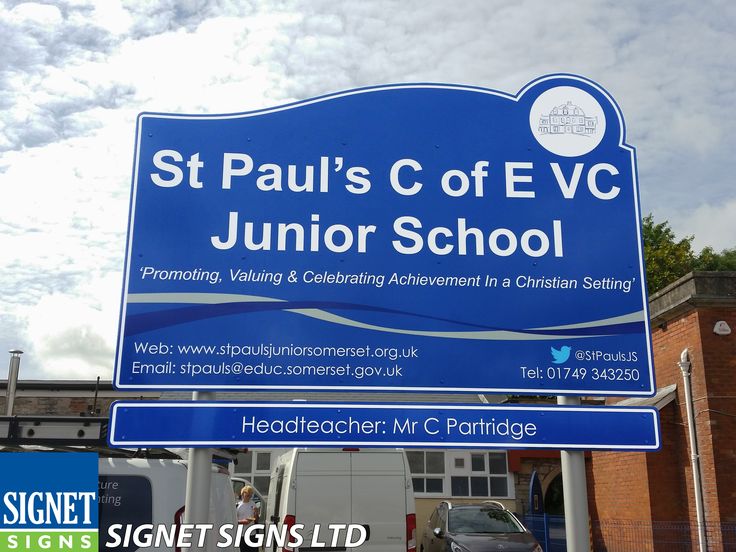 a blue sign that says st paul's c of e v junior school