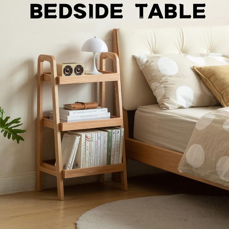 there is a bed side table with books on it