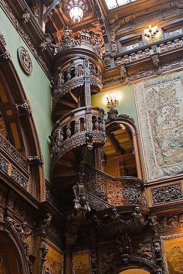 an ornate staircase in the middle of a building