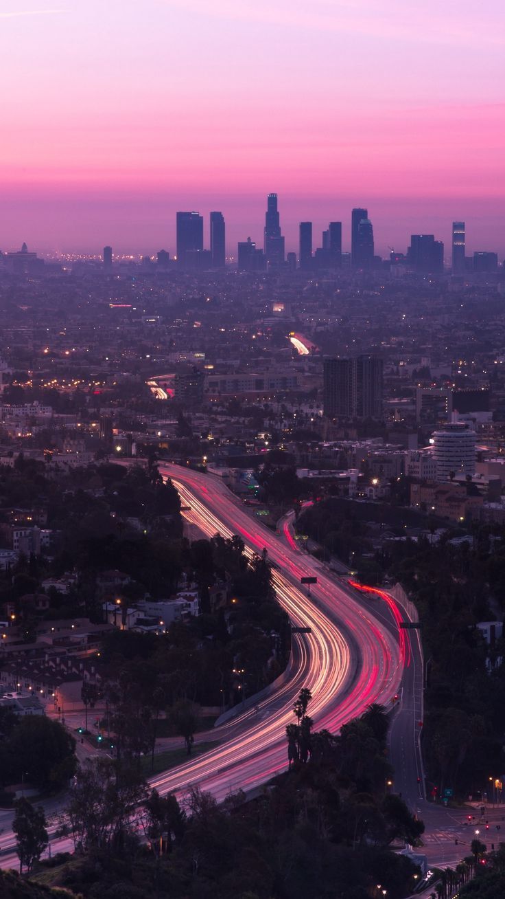 an aerial view of the city at dusk