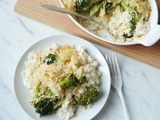 two white plates topped with rice and broccoli