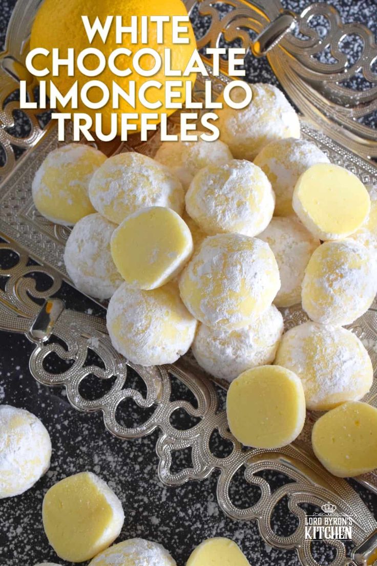 white chocolate limocello truffles on a silver platter with lemons