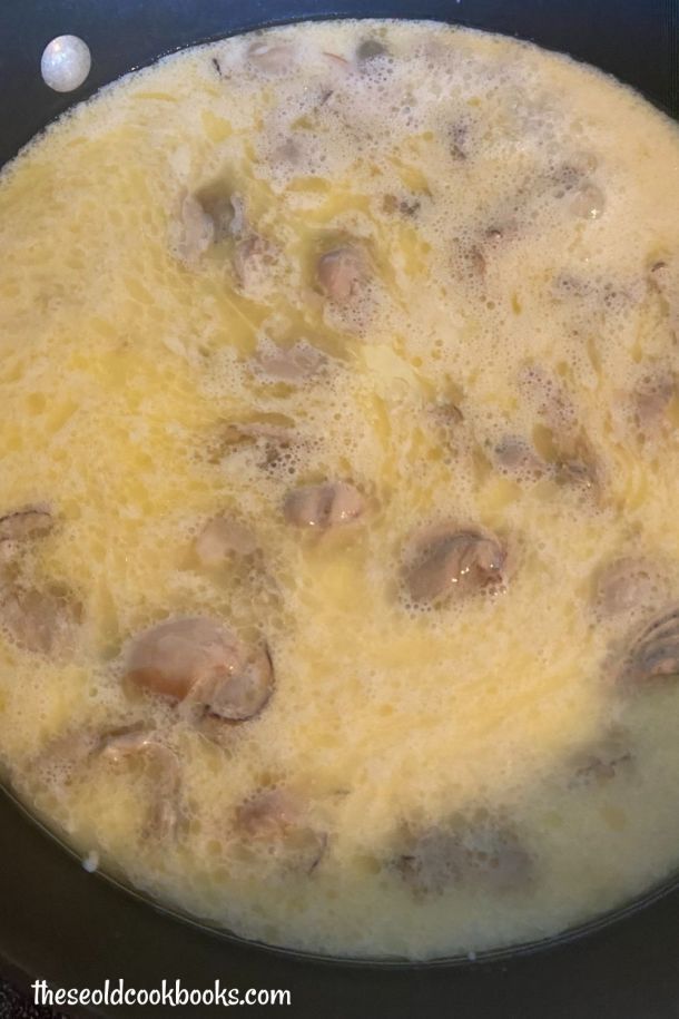 the food is being cooked in the skillet on the stove top, and ready to be eaten