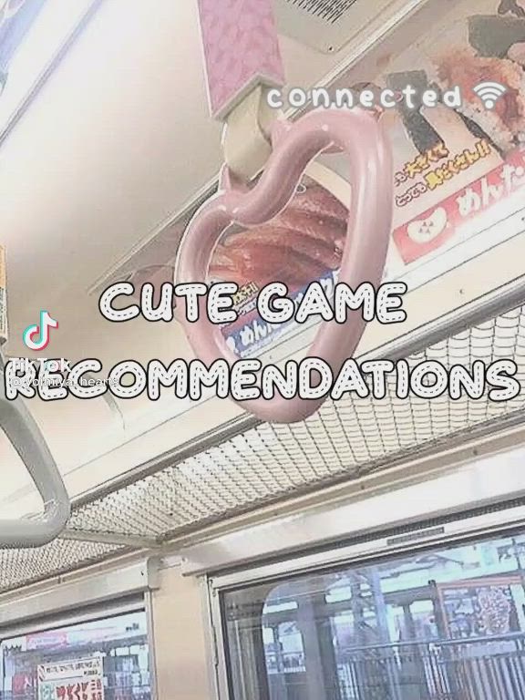 This may contain: a sign that says cute game recommends on the ceiling above a door in a subway car