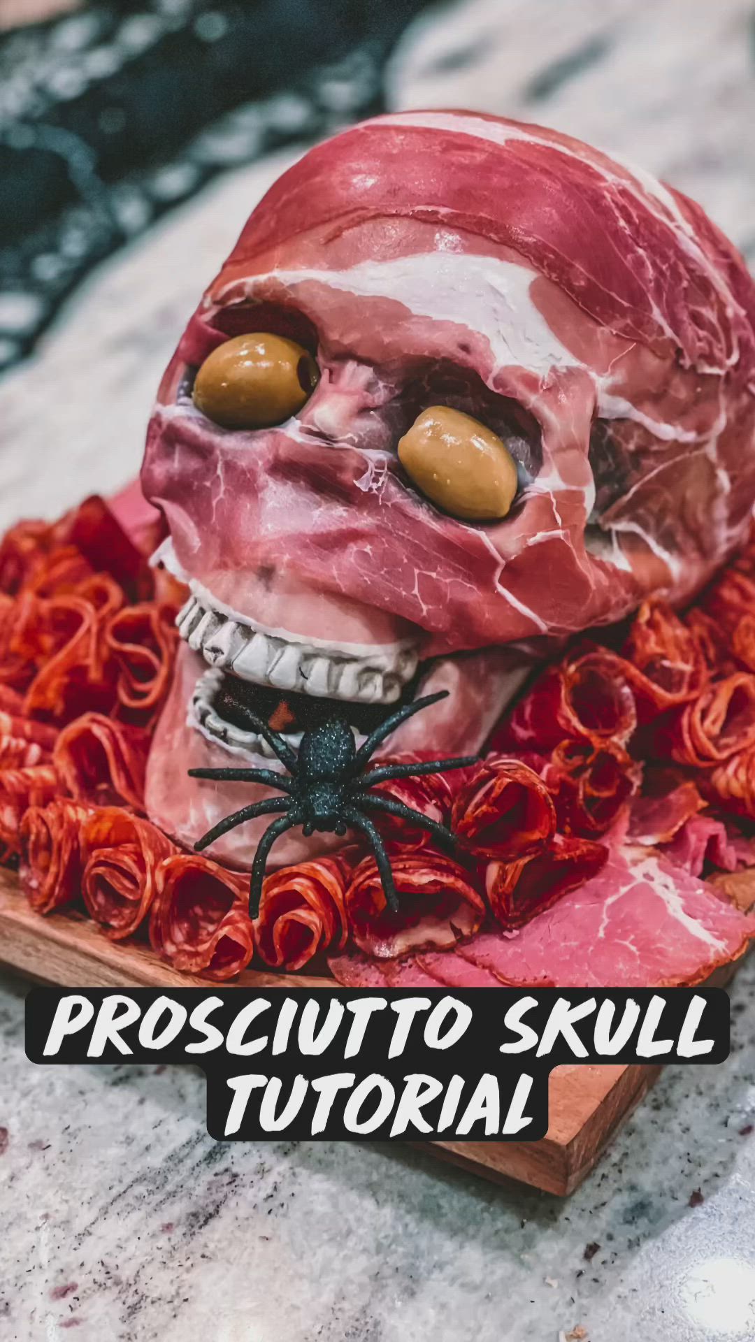 This may contain: a fake meat skull with yellow eyes on top of red spirals in the shape of a human head