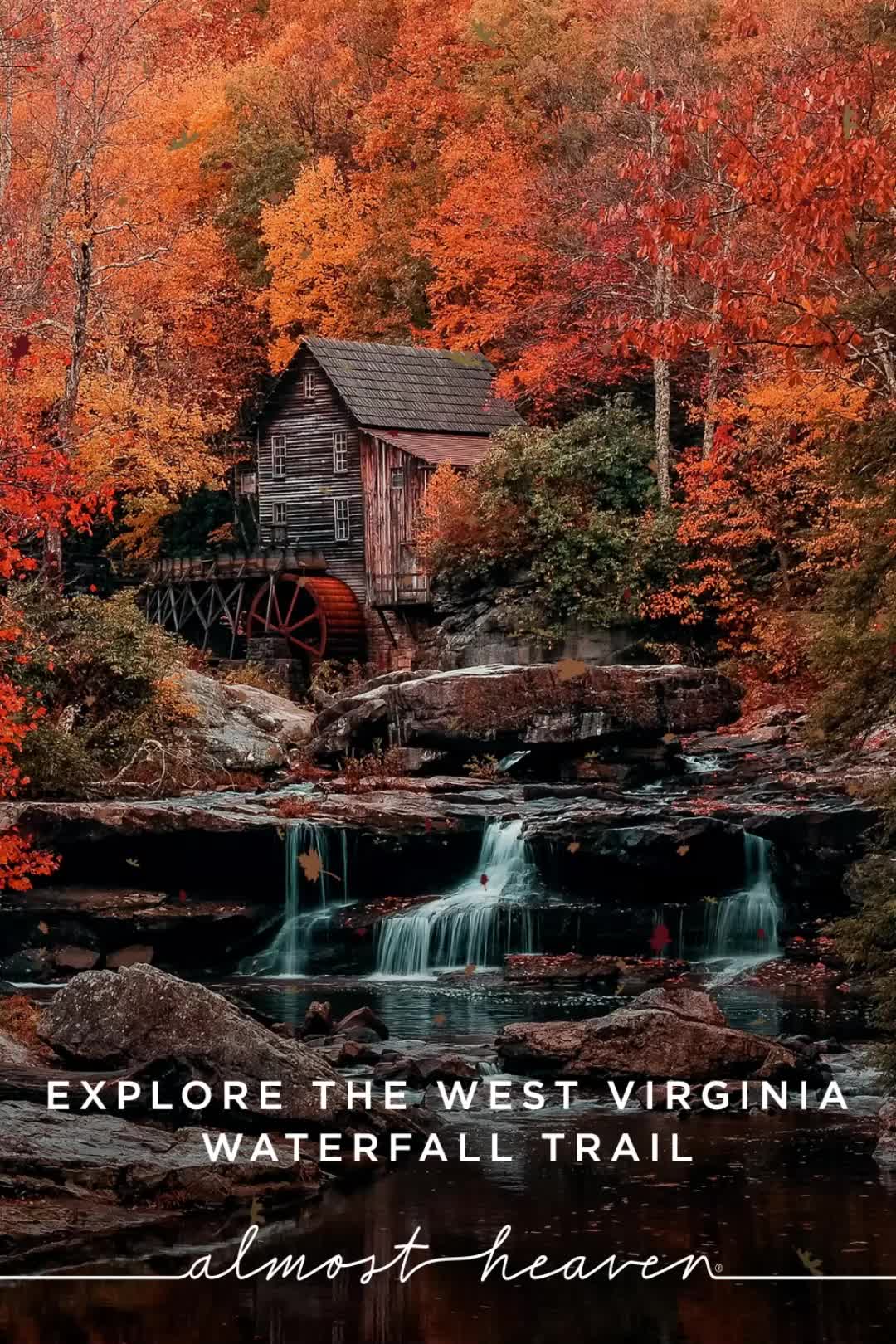 This may contain: an old water mill surrounded by fall foliage and trees with the words explore the west virginia waterfall trail almost heaven