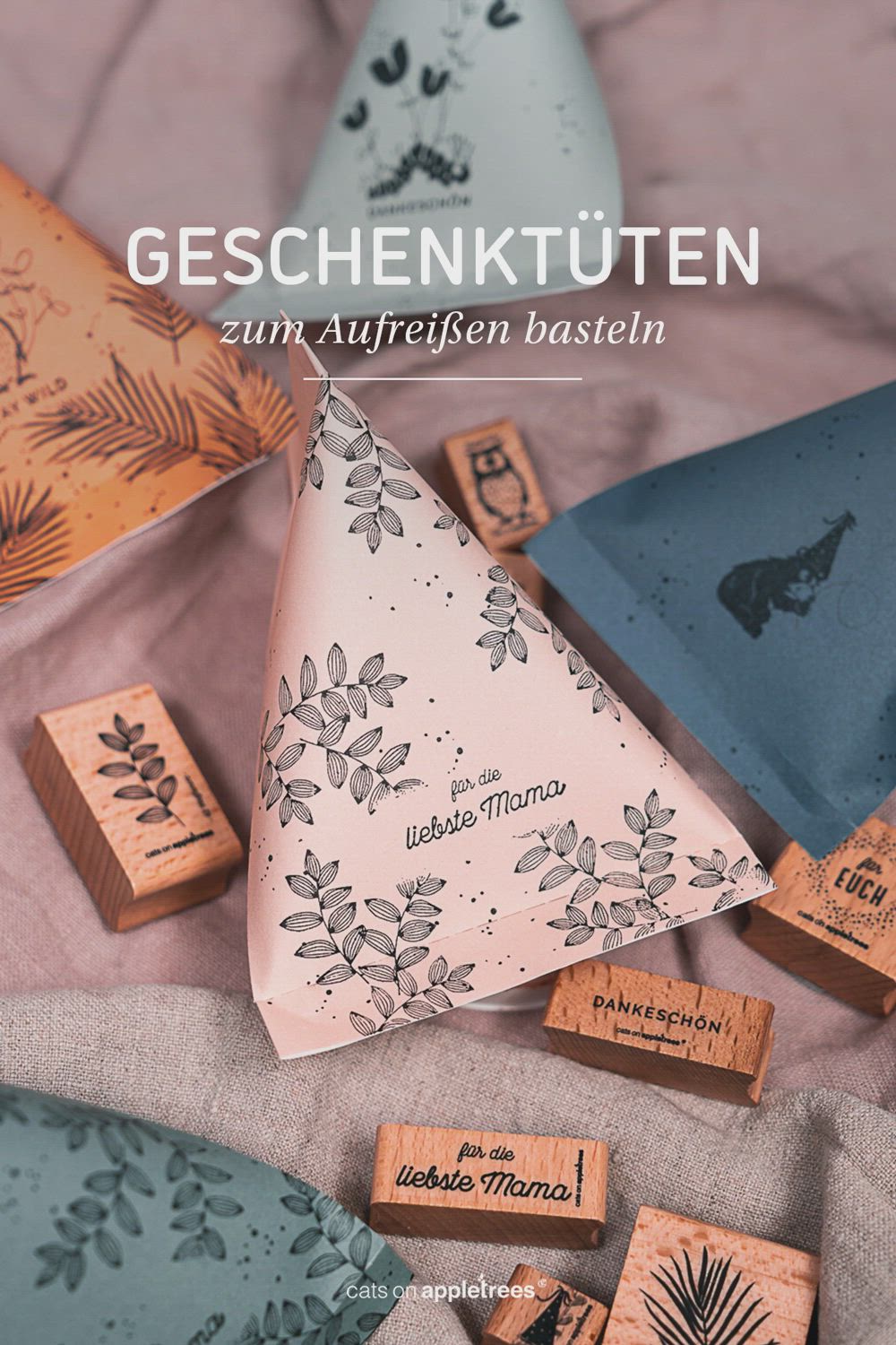 This may contain: several different types of rubber stamps on a bed with the words geschenkuttenn