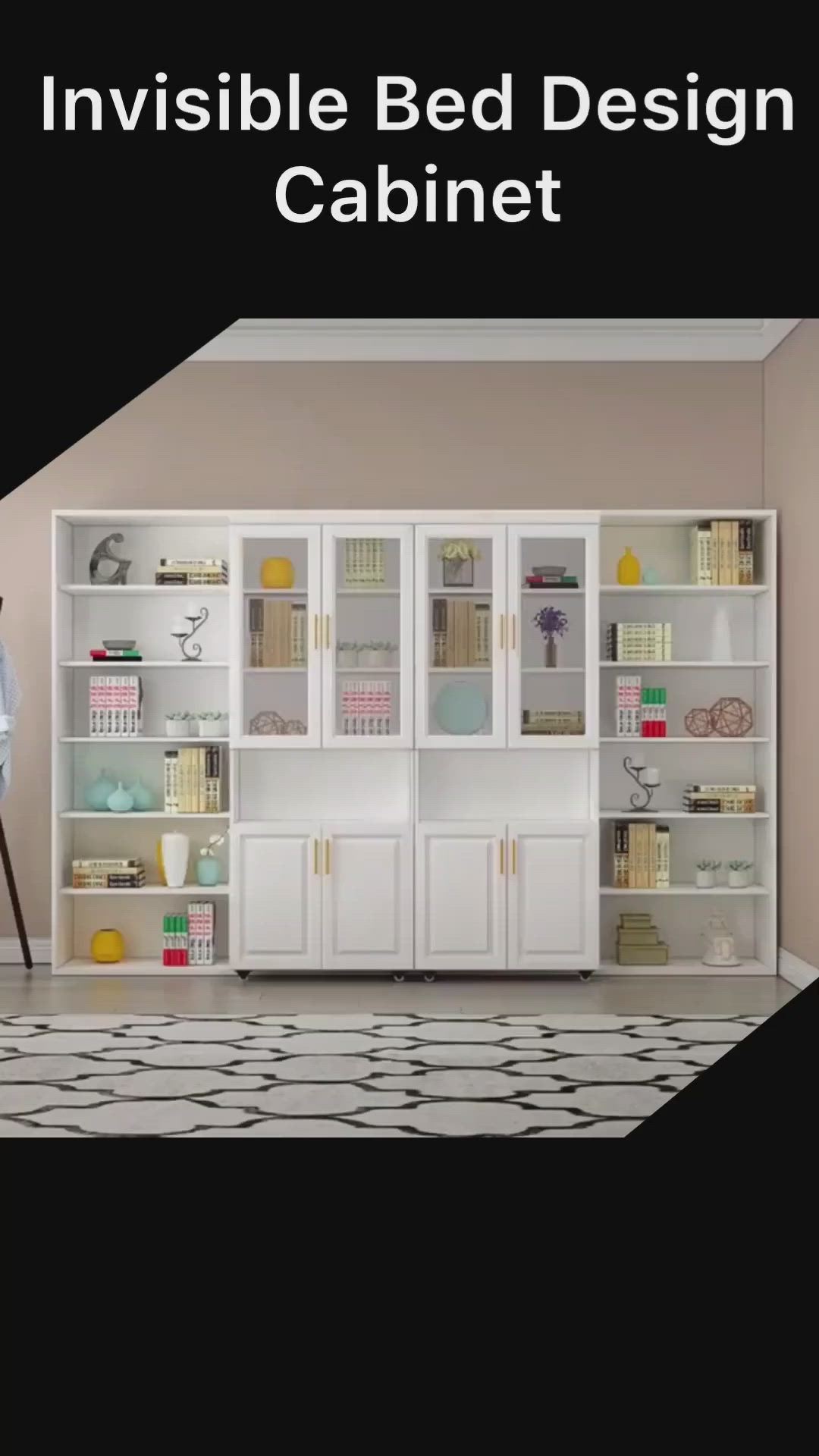 This may contain: a man standing in front of a white bookcase filled with books and other items