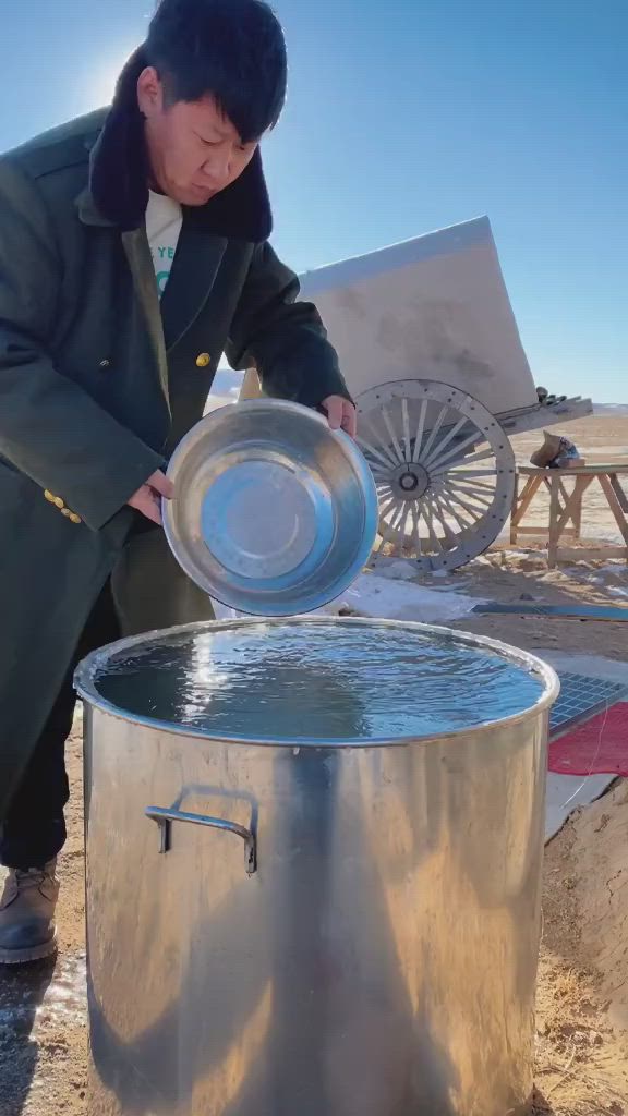 This may contain: a man standing next to a large metal barrel with water in it's mouth