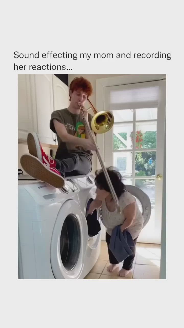 This may contain: a woman standing in front of a dryer next to a man with a trombone