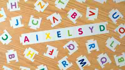 alphabetical letters with dyslexia inscription made of puzzle-style tiles.