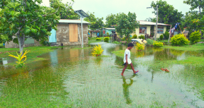 Indigenous Fijian girl walking on flooded land in Fiji. On Feb 2016 Severe Tropical Cyclone Winston was the strongest tropical cyclone in Fiji Islands in recorded history.  Image credit: Shutterstock/ChameleonsEye