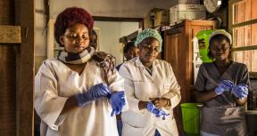 16 January 2019 - Beni, Democratic Republic of Congo.  Health workers put their gloves on before checking patients at the hospital. Photo credit: World Bank / Vincent Tremeau