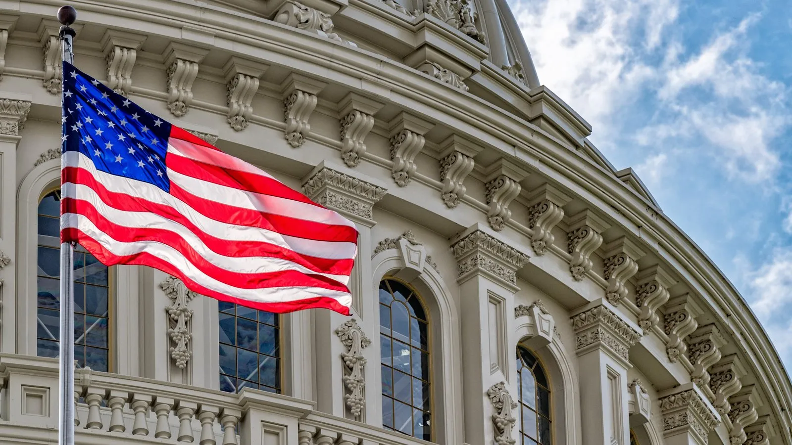 U.S. Capitol and Flag. Source: Shutterstock