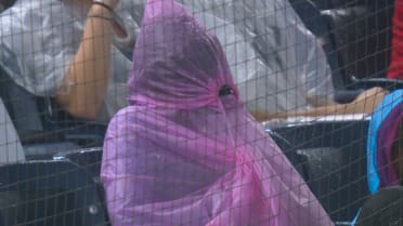 Fan attempts to stay dry in Yankee Stadium