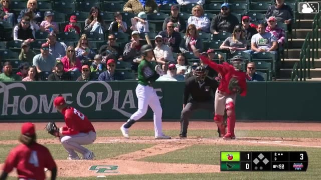 Ethan Salas throws out a runner at second base