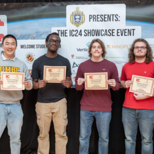 COEIT winners standing in a group with their certificates