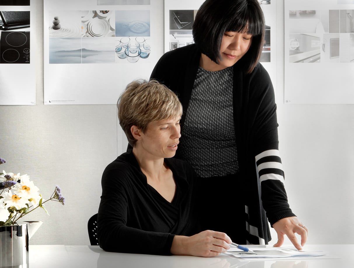 Lifestyle image of women reading a document.