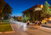 view of bird library from walkway at night time