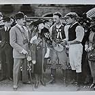 Buck Jones, Jim Mason, Adolphe Menjou, and Eileen Percy in The Fast Mail (1922)