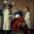 Stacey Farber, Husein Madhavji, and Erica Durance in Saving Hope (2012)