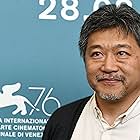 Hirokazu Koreeda at an event for The Truth (2019)