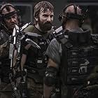 Josh Blacker, Brandon Auret, and Sharlto Copley in Elysium (2013)