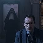 Bonnie Aarons and Demián Bichir in The Nun (2018)