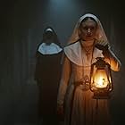 Bonnie Aarons and Taissa Farmiga in The Nun (2018)