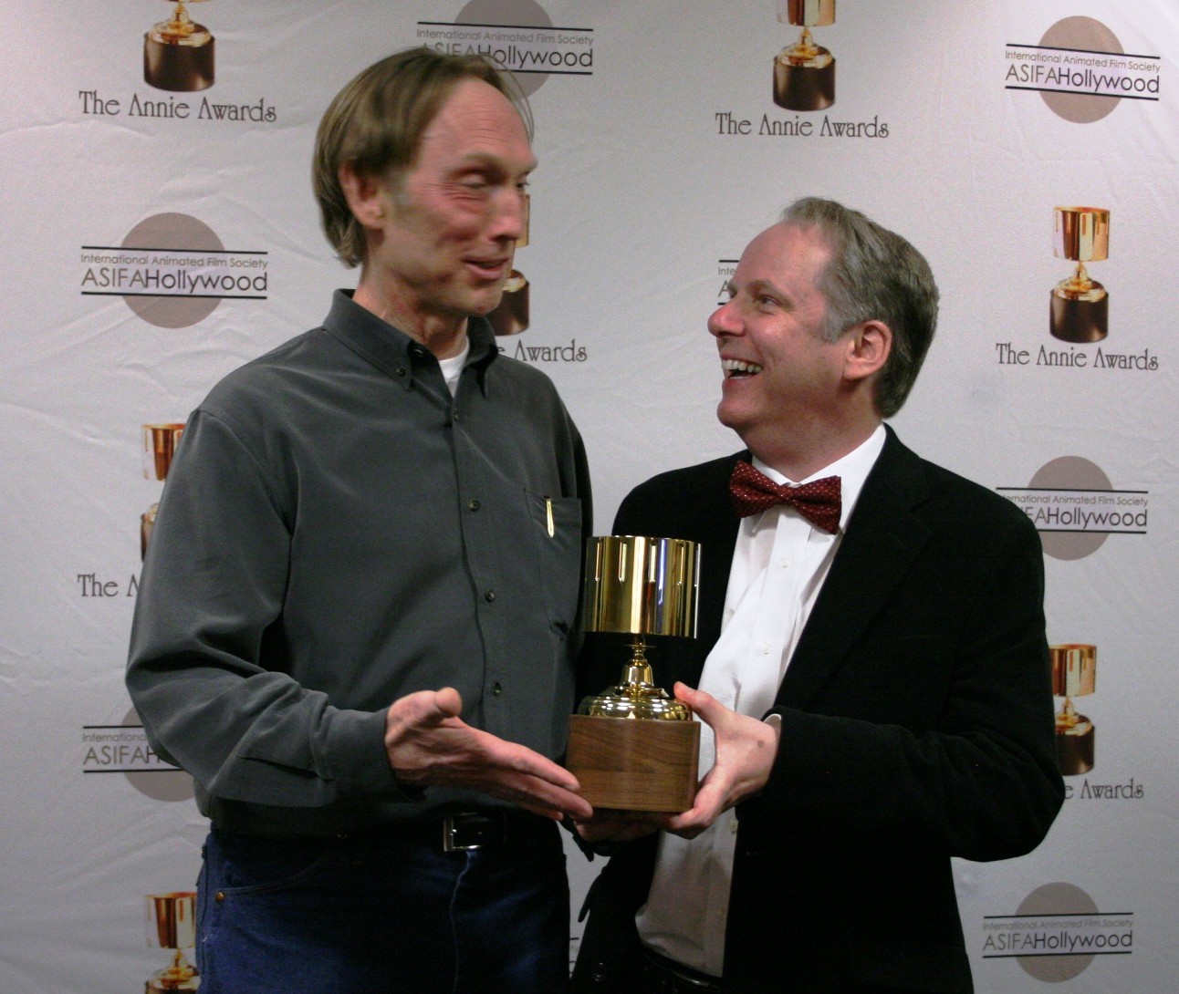 Presenter Henry Selick congratulates Nick Park on his Ub Iwerks award