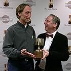 Presenter Henry Selick congratulates Nick Park on his Ub Iwerks award