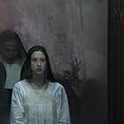 Bonnie Aarons and Taissa Farmiga in The Nun (2018)