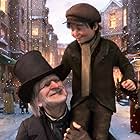 Jim Carrey, Gary Oldman, Ryan Ochoa, and Sage Ryan in A Christmas Carol (2009)