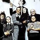 Christina Ricci, Raul Julia, Christopher Lloyd, Anjelica Huston, Christopher Hart, Judith Malina, Carel Struycken, and Jimmy Workman in The Addams Family (1991)