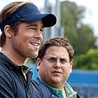 Brad Pitt and Jonah Hill in Moneyball (2011)