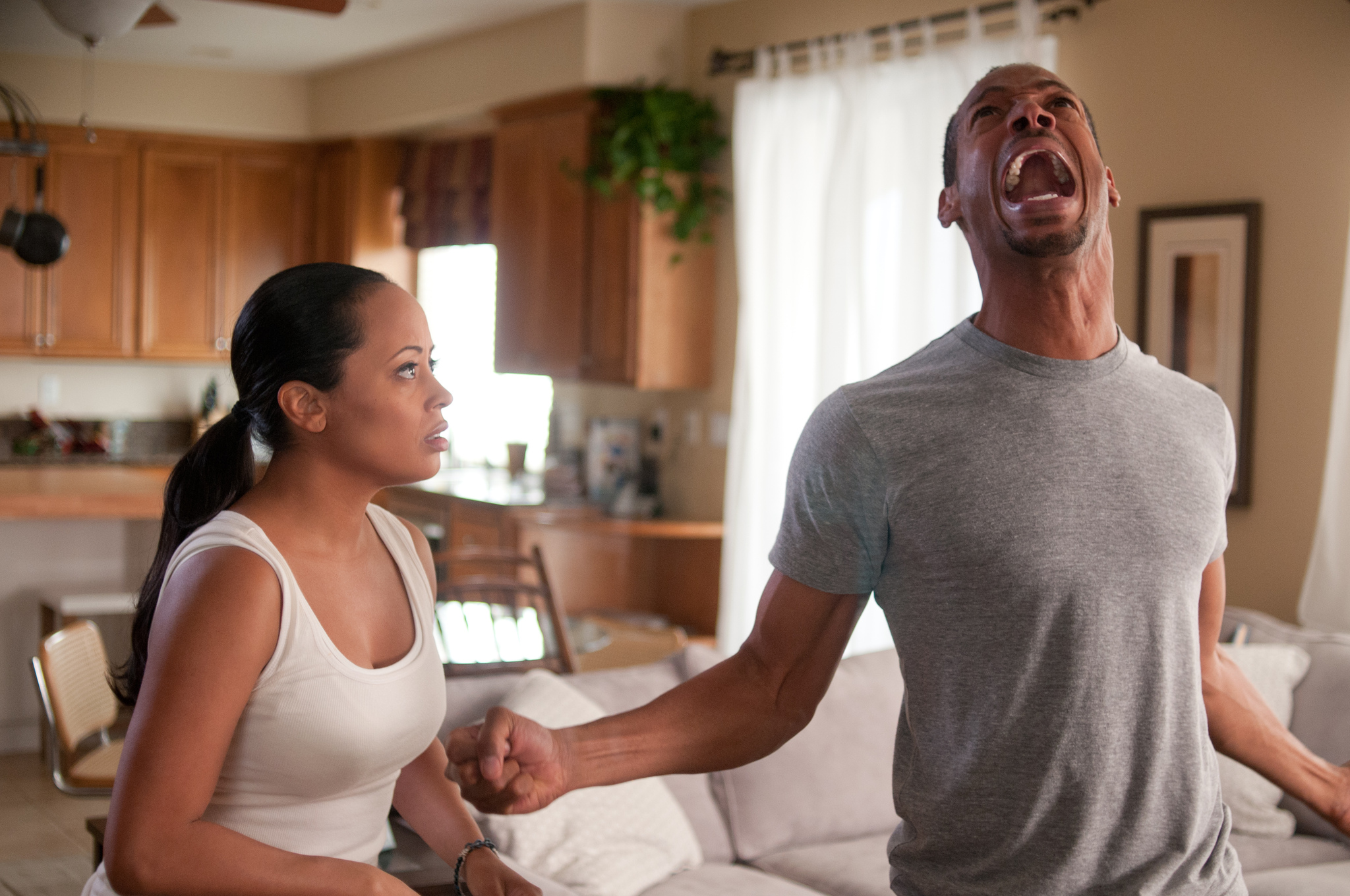 Marlon Wayans and Essence Atkins in A Haunted House (2013)